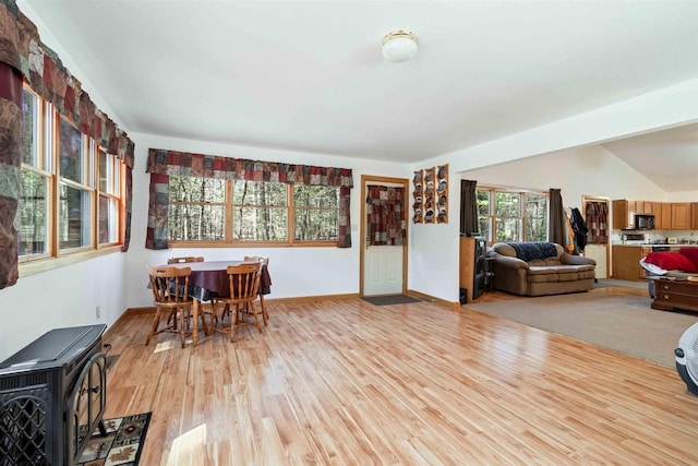 1809 S Badger Ct, Arkdale, WI 54613 - dining area featuring light wood-type flooring, baseboards, and lofted ceiling