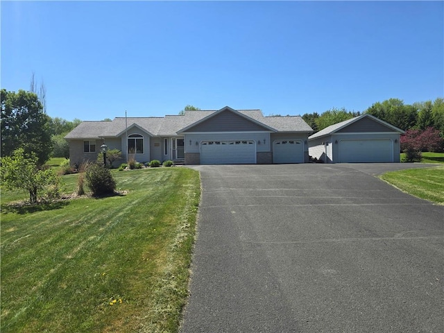 2649 W Menomonie St, Eau Claire, WI 54703 - single story home with a front yard, driveway, and an attached garage