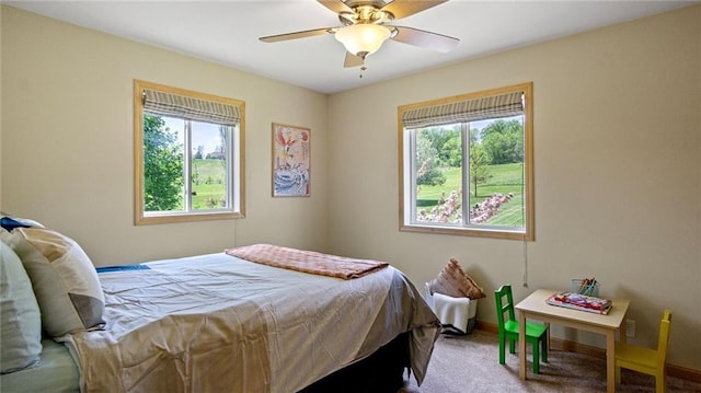 2649 W Menomonie St, Eau Claire, WI 54703 - carpeted bedroom featuring multiple windows, a ceiling fan, and baseboards