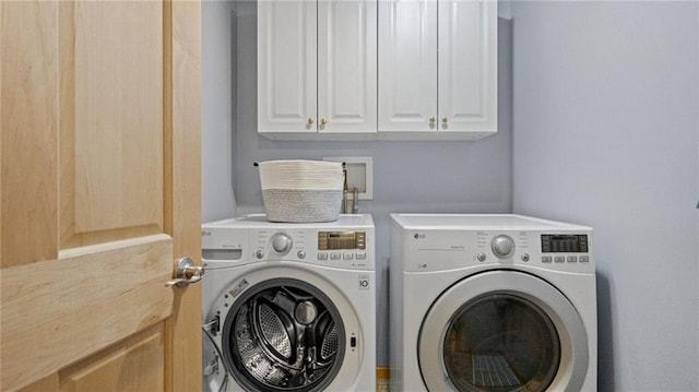 2649 W Menomonie St, Eau Claire, WI 54703 - laundry area featuring washer and dryer and cabinet space