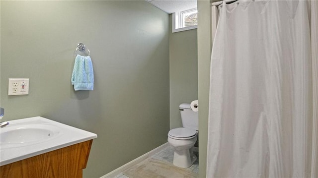 2649 W Menomonie St, Eau Claire, WI 54703 - full bathroom with toilet, vanity, a shower with shower curtain, and baseboards