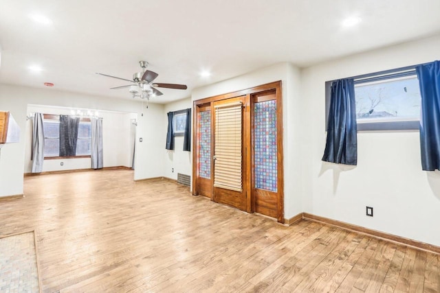 1728 W Capitol Dr, Milwaukee, WI 53206 - unfurnished living room with wood finished floors, ceiling fan, baseboards, and recessed lighting