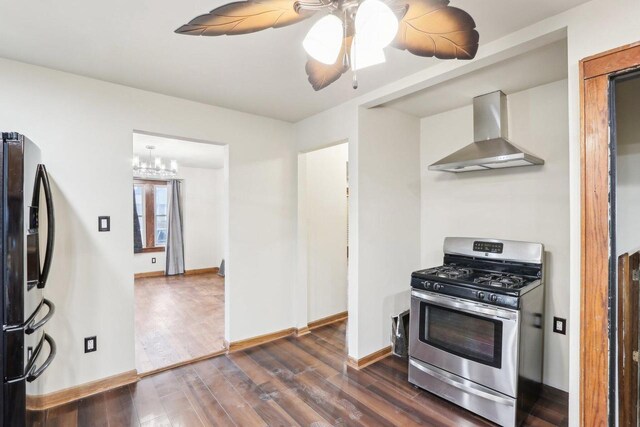 1728 W Capitol Dr, Milwaukee, WI 53206 - kitchen with stainless steel appliances, wall chimney exhaust hood, dark wood-style floors, a ceiling fan, and a chandelier