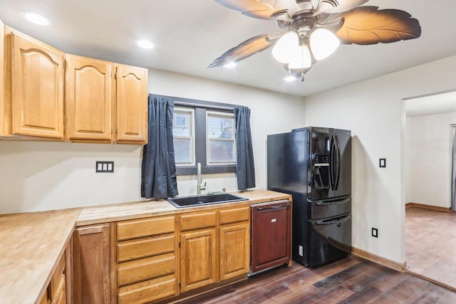 1728 W Capitol Dr, Milwaukee, WI 53206 - kitchen featuring a sink, black fridge, paneled dishwasher, dark wood-style flooring, and ceiling fan