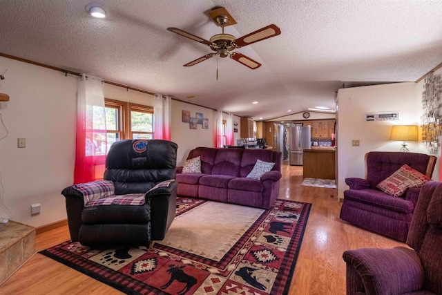 1870 County Road F Unit L69, Friendship, WI 53934 - living area featuring ceiling fan, a textured ceiling, light wood-type flooring, and lofted ceiling
