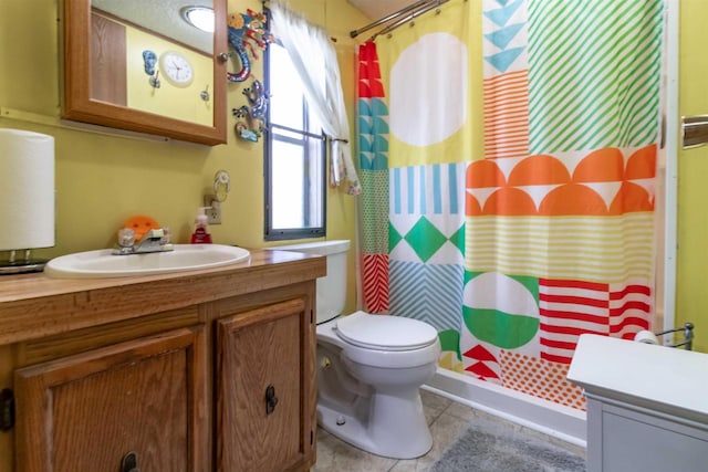 1870 County Road F Unit L69, Friendship, WI 53934 - bathroom featuring vanity, curtained shower, toilet, and tile patterned floors