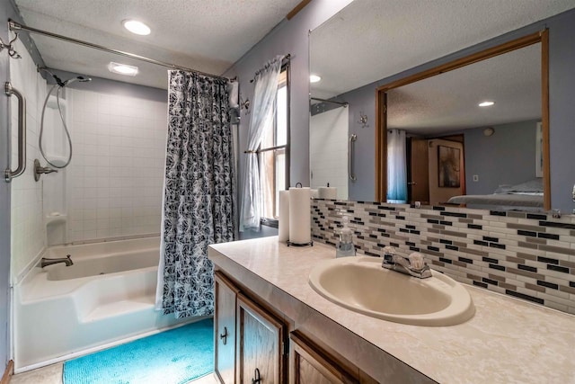 1870 County Road F Unit L69, Friendship, WI 53934 - bathroom featuring a textured ceiling, decorative backsplash, vanity, shower / tub combo, and recessed lighting
