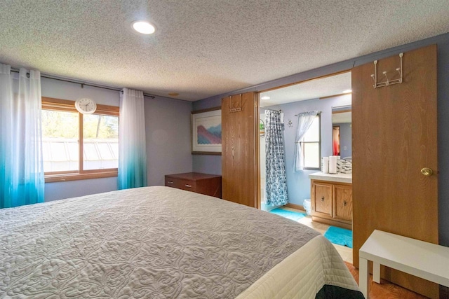 1870 County Road F Unit L69, Friendship, WI 53934 - bedroom featuring a textured ceiling and recessed lighting