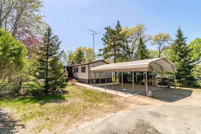 1870 County Road F Unit L69, Friendship, WI 53934 - view of car parking with a carport and dirt driveway