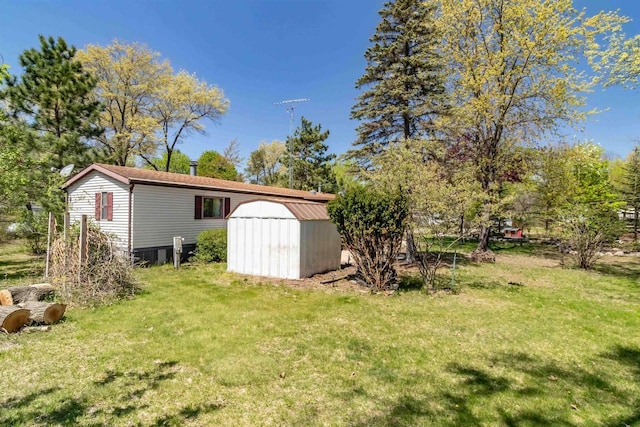 1870 County Road F Unit L69, Friendship, WI 53934 - view of grassy yard with a shed and an outdoor structure