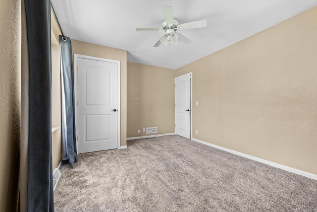 252 Willow Dr, Hartland, WI 53029 - unfurnished bedroom featuring carpet floors, baseboards, and a ceiling fan