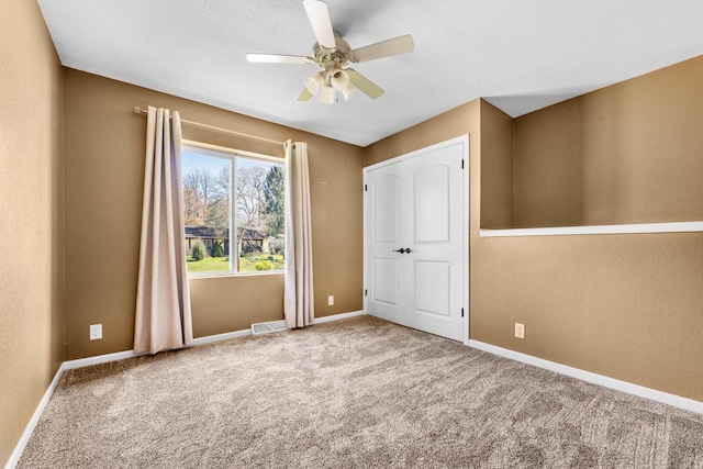 252 Willow Dr, Hartland, WI 53029 - unfurnished bedroom featuring carpet floors, baseboards, and ceiling fan