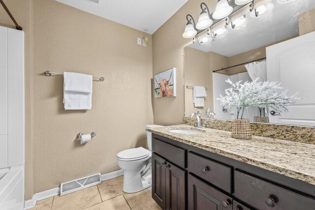 252 Willow Dr, Hartland, WI 53029 - bathroom featuring a textured wall, a shower with curtain, toilet, vanity, and tile patterned flooring