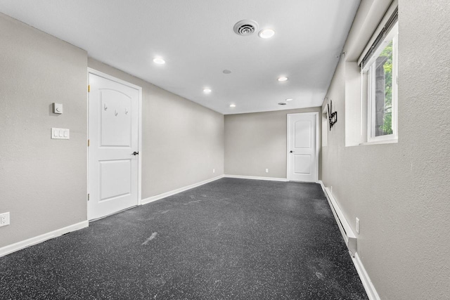 252 Willow Dr, Hartland, WI 53029 - empty room with baseboards, recessed lighting, and a baseboard radiator