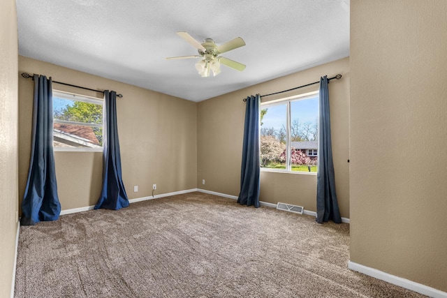 252 Willow Dr, Hartland, WI 53029 - spare room with a ceiling fan, carpet floors, baseboards, and a textured ceiling