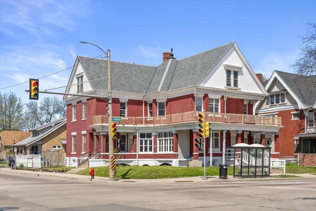 1341 S Layton Blvd Unit 1343, Milwaukee, WI 53215 - view of property featuring a chimney and brick siding
