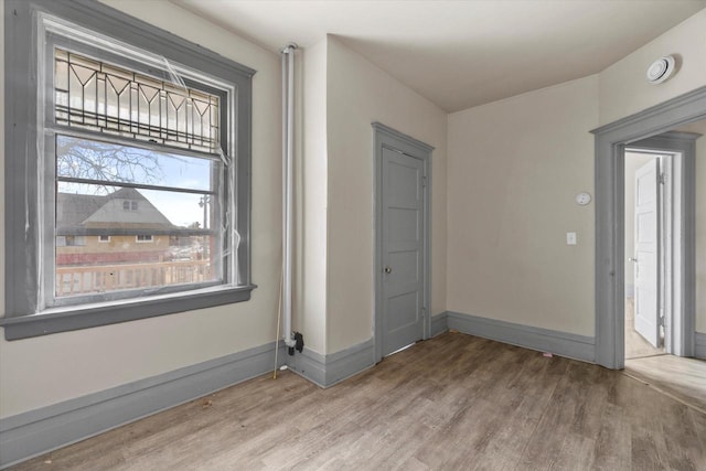 1341 S Layton Blvd Unit 1343, Milwaukee, WI 53215 - empty room featuring wood finished floors, a smoke detector, and baseboards