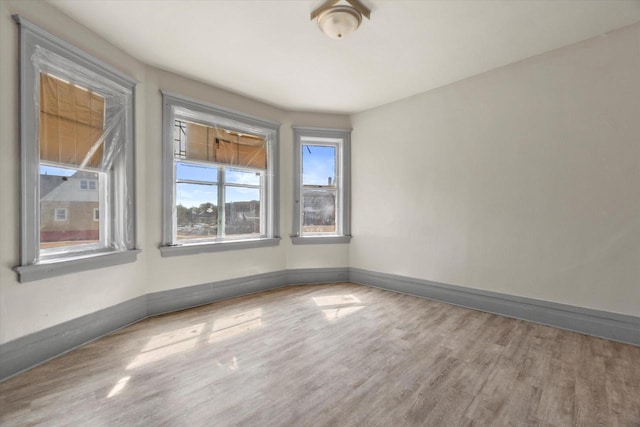 1341 S Layton Blvd Unit 1343, Milwaukee, WI 53215 - spare room featuring wood finished floors and baseboards