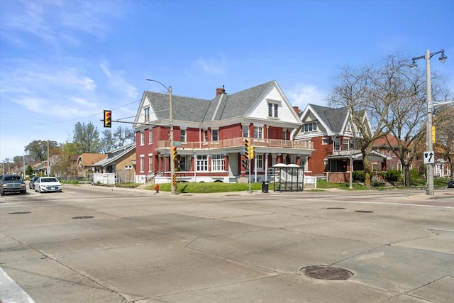 1341 S Layton Blvd Unit 1343, Milwaukee, WI 53215 - view of front of house with a chimney and a balcony