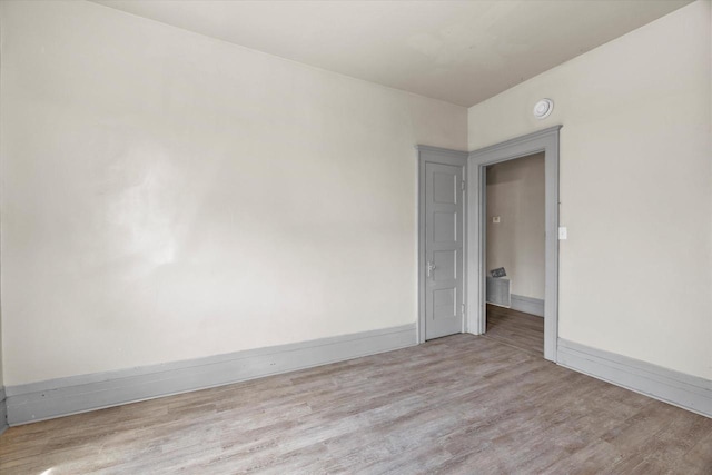 1341 S Layton Blvd Unit 1343, Milwaukee, WI 53215 - spare room featuring wood finished floors and baseboards