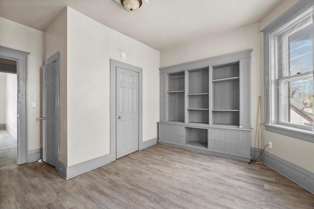 1341 S Layton Blvd Unit 1343, Milwaukee, WI 53215 - unfurnished bedroom featuring wood finished floors and baseboards