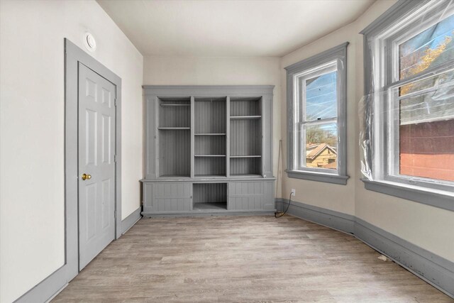 1341 S Layton Blvd Unit 1343, Milwaukee, WI 53215 - unfurnished bedroom featuring wood finished floors and baseboards
