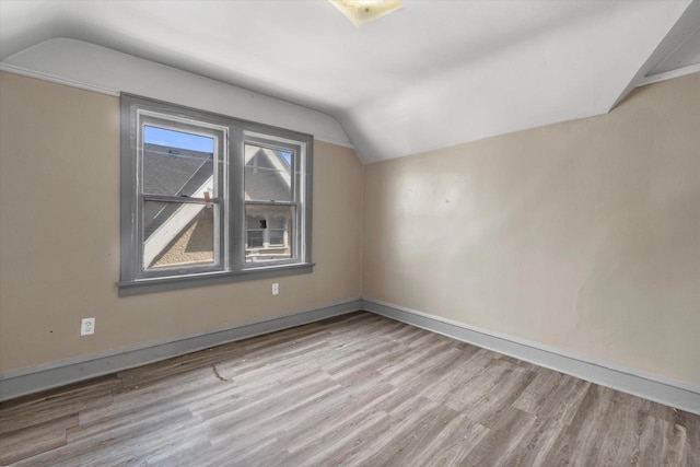 1341 S Layton Blvd Unit 1343, Milwaukee, WI 53215 - additional living space with vaulted ceiling, wood finished floors, and baseboards