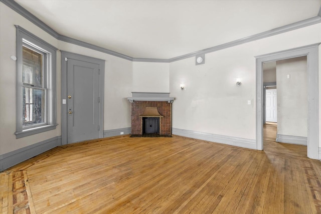 1341 S Layton Blvd Unit 1343, Milwaukee, WI 53215 - unfurnished living room featuring a brick fireplace, ornamental molding, light wood-style flooring, and baseboards
