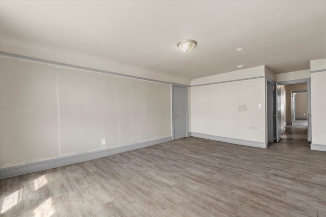 1341 S Layton Blvd Unit 1343, Milwaukee, WI 53215 - unfurnished room featuring wood finished floors and baseboards