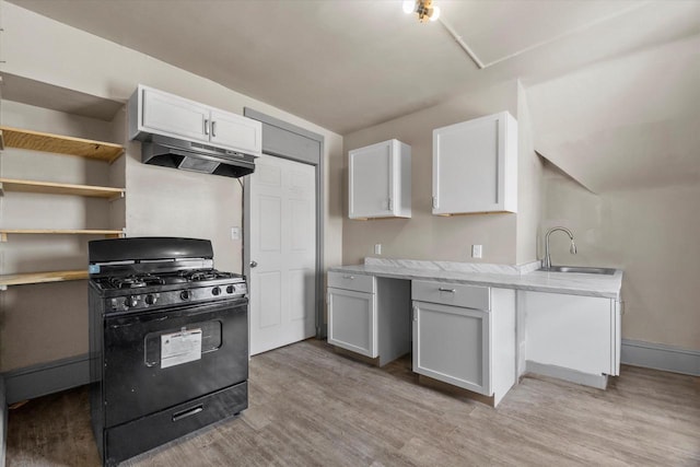 1341 S Layton Blvd Unit 1343, Milwaukee, WI 53215 - kitchen featuring black gas stove, a sink, under cabinet range hood, and light countertops