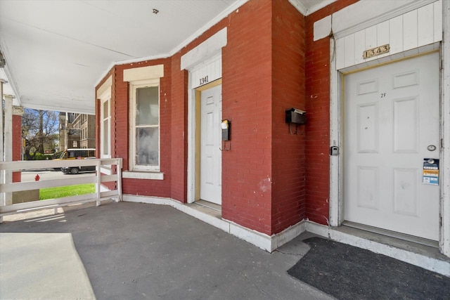 1341 S Layton Blvd Unit 1343, Milwaukee, WI 53215 - entrance to property featuring covered porch and brick siding