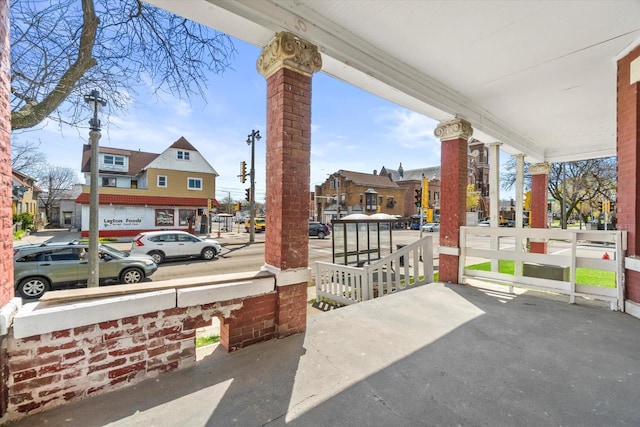 1341 S Layton Blvd Unit 1343, Milwaukee, WI 53215 - view of patio / terrace featuring covered porch and a residential view