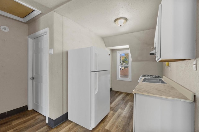 1341 S Layton Blvd Unit 1343, Milwaukee, WI 53215 - kitchen featuring freestanding refrigerator, wood finished floors, light countertops, white cabinetry, and a sink