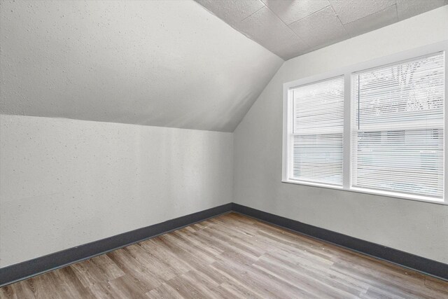 1341 S Layton Blvd Unit 1343, Milwaukee, WI 53215 - bonus room with vaulted ceiling, wood finished floors, and baseboards