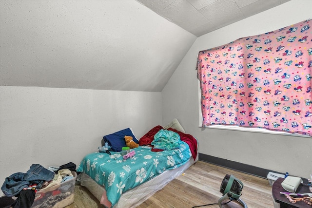 1341 S Layton Blvd Unit 1343, Milwaukee, WI 53215 - bedroom featuring wood finished floors and lofted ceiling