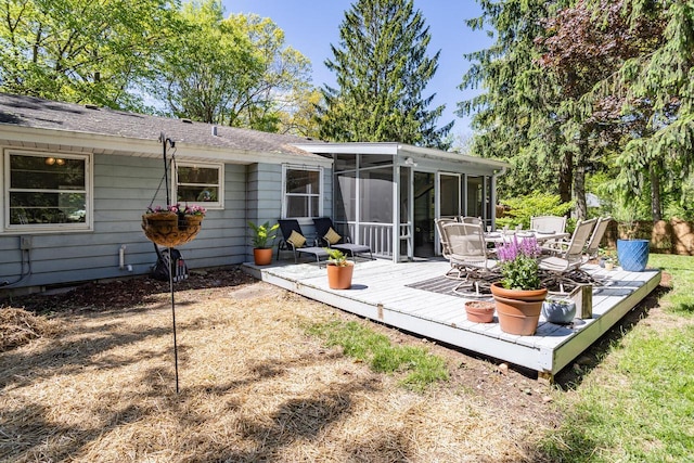 N56W27528 Lisbon Rd, Lisbon, WI 53089 - back of property with a sunroom, a deck, and outdoor dining space