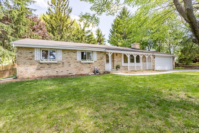 N56W27528 Lisbon Rd, Lisbon, WI 53089 - single story home featuring a porch, a chimney, a garage, and a front yard