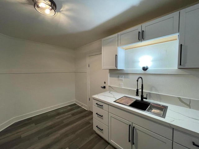 3158 N 39th St Unit 3160, Milwaukee, WI 53216 - kitchen with a sink, dark wood-type flooring, light stone counters, baseboards, and white cabinets