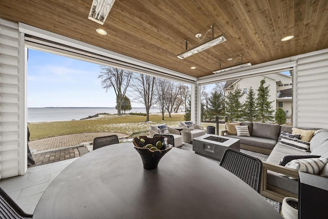 536 Sunrise Bay Rd, Neenah, WI 54956 - view of patio with a water view, an outdoor living space with a fire pit, and outdoor dining space