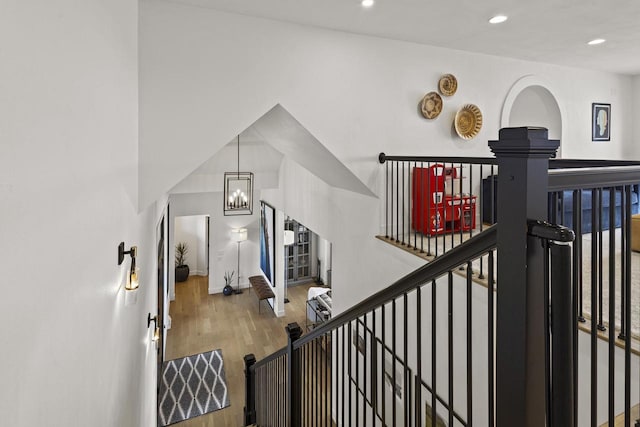 536 Sunrise Bay Rd, Neenah, WI 54956 - stairway featuring wood finished floors, a chandelier, recessed lighting, and baseboards
