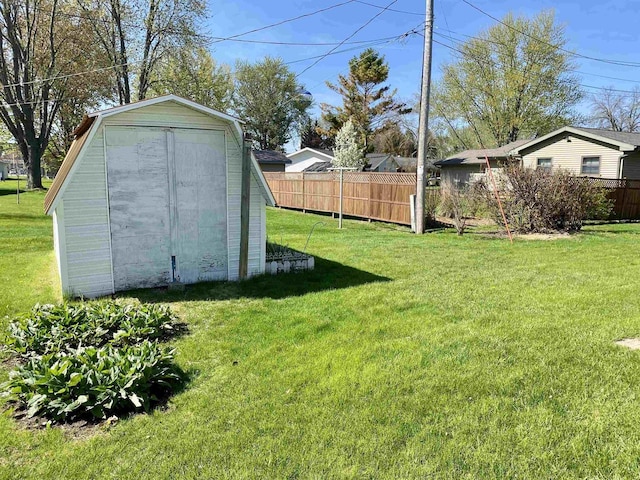 view of yard with a shed and an outbuilding