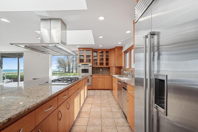 7515 N Beach Dr, Fox Point, WI 53217 - kitchen with appliances with stainless steel finishes, island range hood, a sink, backsplash, and recessed lighting