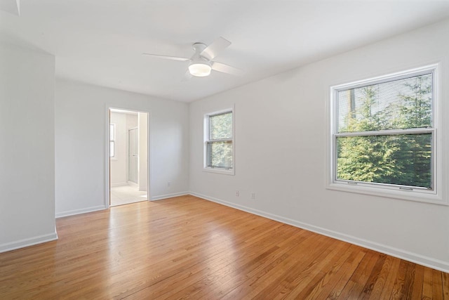 7515 N Beach Dr, Fox Point, WI 53217 - unfurnished room with light wood finished floors, baseboards, and ceiling fan