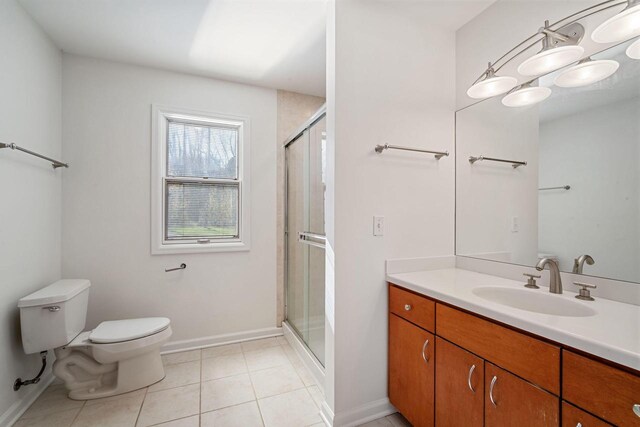 7515 N Beach Dr, Fox Point, WI 53217 - full bath featuring toilet, a shower stall, tile patterned flooring, vanity, and baseboards