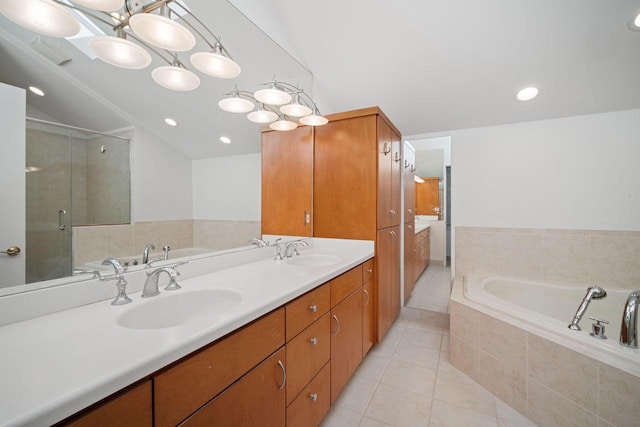 7515 N Beach Dr, Fox Point, WI 53217 - full bath featuring tile patterned flooring, vaulted ceiling, double vanity, a bath, and a stall shower