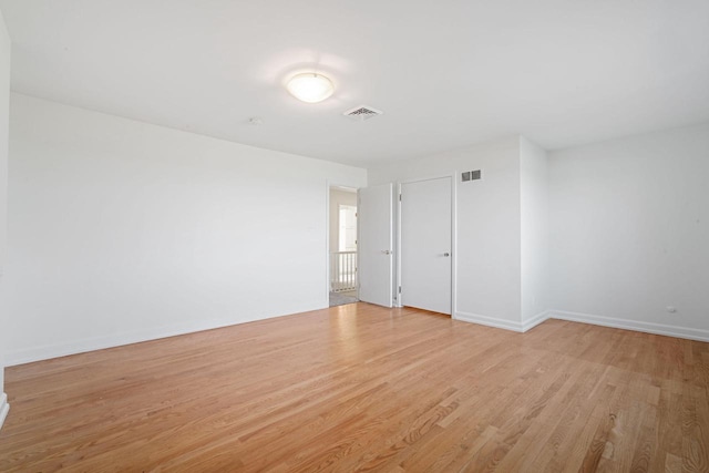 7515 N Beach Dr, Fox Point, WI 53217 - spare room featuring light wood-type flooring and baseboards