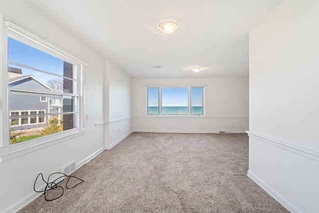 7515 N Beach Dr, Fox Point, WI 53217 - unfurnished room featuring carpet flooring and baseboards