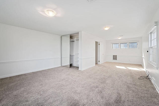 7515 N Beach Dr, Fox Point, WI 53217 - unfurnished bedroom featuring carpet flooring, a closet, and baseboards