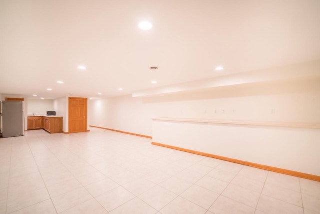 7515 N Beach Dr, Fox Point, WI 53217 - finished basement with freestanding refrigerator, recessed lighting, and baseboards