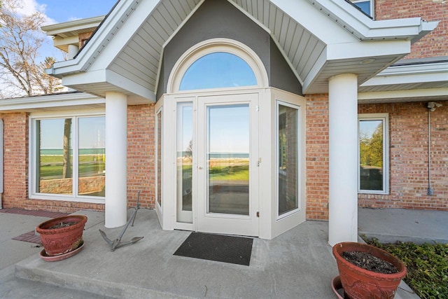 7515 N Beach Dr, Fox Point, WI 53217 - property entrance featuring a patio and brick siding